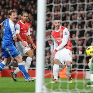 Robin van Persie scores his and Arsenals 3rd goal past Ali Al Habsi (Wigan) Robin van Persie scores his and Arsenals 3rd goal past Ali Al Habsi (Wigan)