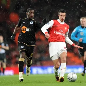 Robin van Persie Scores Twice: Arsenal Defeats Wigan Athletic 2-0 in Carling Cup Quarterfinals