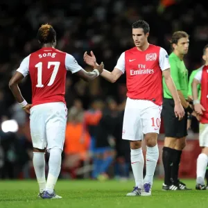 Robin van Persie shakes hands with Alex Song (Arsenal) at the end of the match Robin van Persie shakes hands with Alex Song (Arsenal) at the end of the match