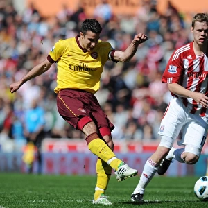 Robin van Persie shoots past Asmir Begovic to score the Arsenal goal. Stoke City 3
