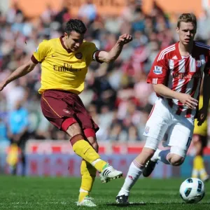 Robin van Persie shoots past Asmir Begovic to score the Arsenal goal. Stoke City 3