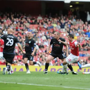 Robin van Persie shoots past Aston Villa goalkeeper Brad Friedel to score the Arsenal goal Robin van Persie shoots past Aston Villa goalkeeper Brad Friedel to score the Arsenal goal