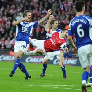 Robin van Persie shoots past Birmingham goalkeeper Ben Foster for the Arsenal goal Robin van Persie shoots past Birmingham goalkeeper Ben Foster for the Arsenal goal