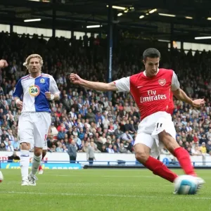 Robin van Persie shoots past Blackburn goalkeeper Brad Friedel to score the Arsenal goal