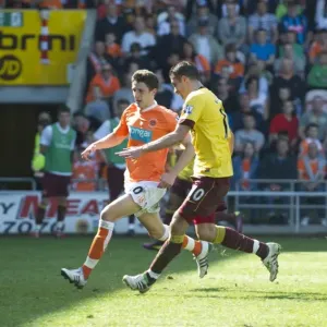 Robin van Persie shoots past Blackpool goalkeeper Richard Kindson to score the 3rd Arsenal goal