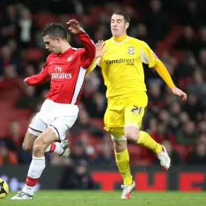 Robin van Persie shoots past Cardiff goalkeeper Tom Robin van Persie shoots past Cardiff goalkeeper Tom