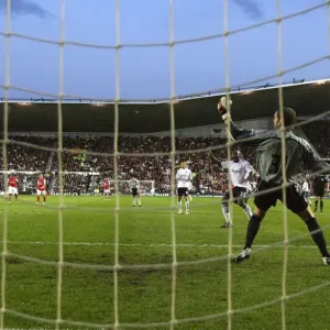 Robin van Persie shoots past Derby goalkeeper Roy Carroll to score the 2nd Arsenal goal