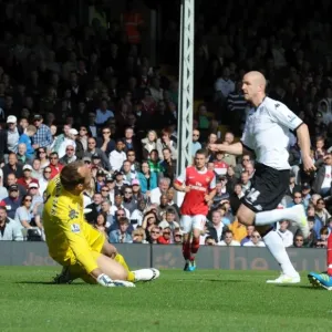 Robin van Persie shoots past Fulham goalkeeper Mark Schwarzer to score the 1st Arsenal goal