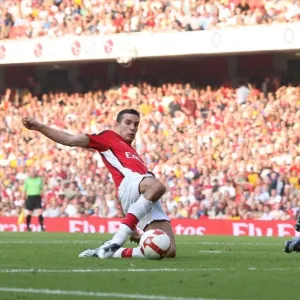 Robin van Persie shoots past Habib Beye to score the 2nd Arsenal goal Robin van Persie shoots past Habib Beye to score the 2nd Arsenal goal