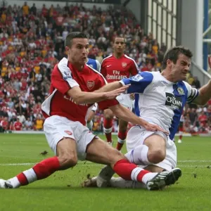 Robin van Persie shoots past Ryan Nelson to score Robin van Persie shoots past Ryan Nelson to score