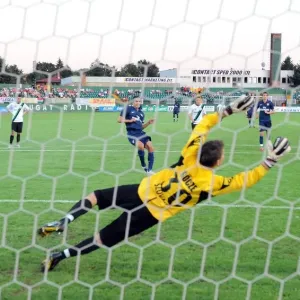Robin van Persie shoots past Szombathelyi goalkeeoer Robin van Persie shoots past Szombathelyi goalkeeoer