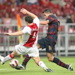 Robin van Persie shoots past Thomas Vermaelen to score the Arsenal goal Robin van Persie shoots past Thomas Vermaelen to score the Arsenal goal