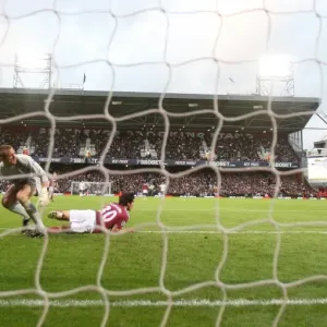 Robin van Persie shoots past West Ham goalkeeper Robert