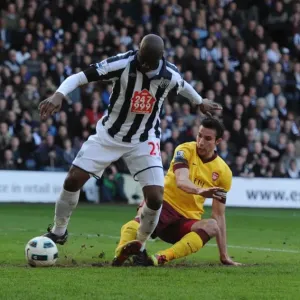 Robin van Persie taps the ball past WBA goalkeeper Scott Carson to score the 2nd Arsenal goal