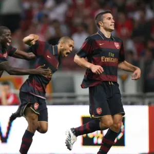 Robin van Persie's Euphoric Goal Celebration with Teammates Eboue, Eduardo, and Clichy: Arsenal's Historic Win at Ajax ArenA (4/8/07) Robin van Persie's Euphoric Goal Celebration with Teammates Eboue, Eduardo, and Clichy: Arsenal's Historic Win at Ajax ArenA (4/8/07)