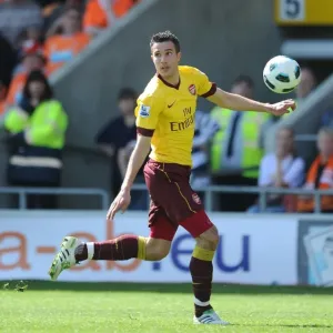 Robin van Persie's Hat-Trick: Arsenal's 3-1 Crushing Victory Over Blackpool in the Premier League
