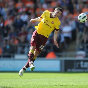 Robin van Persie's Hat-Trick: Arsenal's Triumphant 3-1 Victory Over Blackpool in the Premier League