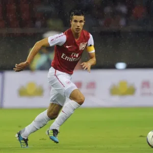 Robin van Persie's Pre-Season Glory: Arsenal Star's Brilliant Performance against Hangzhou Greentown, China (2011) Robin van Persie's Pre-Season Glory: Arsenal Star's Brilliant Performance against Hangzhou Greentown, China (2011)