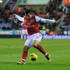 Robin van Persie's Trickery: Arsenal's Star Forward Dazzles Wigan Athletic in Premier League Clash, 2011-12