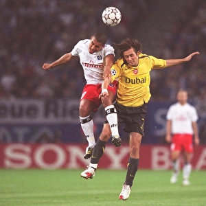 Rosicky and De Jong Clash: Hamburg vs. Arsenal in UEFA Champions League