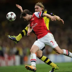 Rosicky vs. Schmelzer: A Champions League Showdown at the Emirates