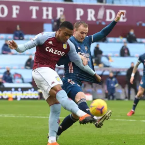 Rrob Holding vs Ezri Konsa: A Battle at Villa Park in Empty Premier League Stadiums (Aston Villa vs Arsenal, 2021)