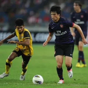 Ryo Miyaichi vs Ahmad Shakir Md Ali: A Football Showdown in the 2012-13 Arsenal Pre-Season Match in Malaysia