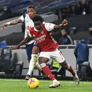 Saka Stands Strong: Bukayo Faces Off Against Bergwijn and Aurier in Intense Arsenal-Tottenham Showdown, 2020-21 Premier League Saka Stands Strong: Bukayo Faces Off Against Bergwijn and Aurier in Intense Arsenal-Tottenham Showdown, 2020-21 Premier League