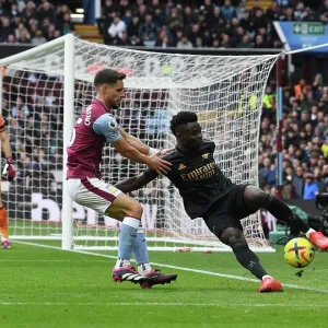 Saka vs Moreno: A Wing Battle at Villa Park - Intense Showdown between Arsenal's Bukayo Saka and Aston Villa's Alexandre Moreno, Premier League 2022-23