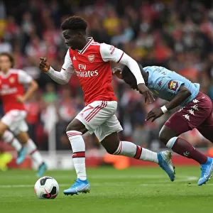 Saka vs. Nakamba: Intense Face-Off in Arsenal's Battle Against Aston Villa