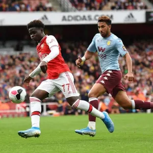 Saka vs. Trezeguet: A Premier League Showdown - Intense Face-Off Between Arsenal's Young Gun and Aston Villa's Midfielder
