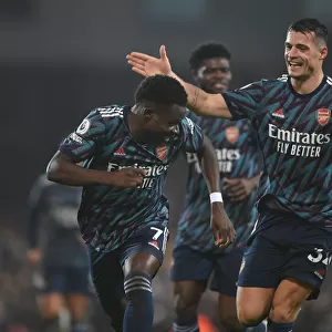Saka and Xhaka Celebrate Arsenal's Victory over Norwich City in the Premier League