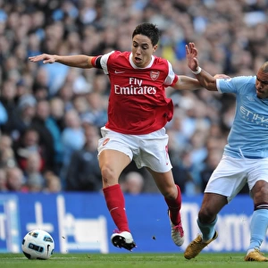 Sami Nasri (Arsenal) Nigel De Jong and Vincent Kompany (Man City). Manchester City 0