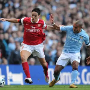 Sami Nasri (Arsenal) Nigel De Jong and Vincent Kompany (Man City). Manchester City 0 Sami Nasri (Arsenal) Nigel De Jong and Vincent Kompany (Man City). Manchester City 0