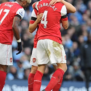 Sami Nasri and Cesc Fabregas celebrate the 2nd Arsenal goal, scored by Alex Song