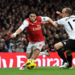 Samir Nasri (Arsenal) Danny Murphy (Fulham). Arsenal 2: 1 Fulham. Barclays Premier League