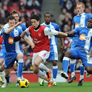 Samir Nasri (Arsenal) Gary Caldwell and Hendry Thomas (Wigan). Arsenal 3: 0 Wigan Athletic