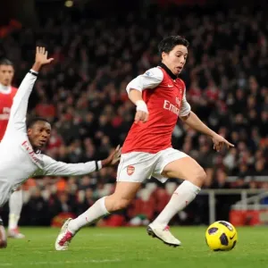 Samir Nasri beats Dickson Etuhu and John Pantsil (Fulham) on his way to scoring his Samir Nasri beats Dickson Etuhu and John Pantsil (Fulham) on his way to scoring his