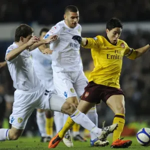 Samir Nasri breaks past Leeds defender Ben Parker to score the 1st Arsenal goal
