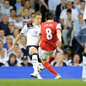 Samir Nasri scores Arsenals 2nd goal past Michael Dawson (Tottenham)