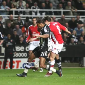 Samir Nasri shoots past Newcastle goalkeeper Steve