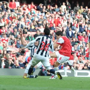 Samir Nasri shoots past WBA goalkeeper Scott Carson to score the 2nd Arsenal goal