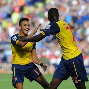 Sanchez and Sanogo: Arsenal's Unstoppable Duo Celebrates Goal Against Leicester City (2014-15)
