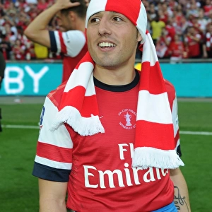 Santi Cazorla's FA Cup Triumph: Arsenal's Victory Celebration at Wembley Stadium