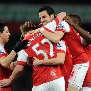 Sebastien Squillaci celebrates scoring for Arsenal with his team mates including Cesc Fabregas
