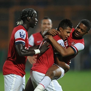 Serge Gnabry celebrates scoring Arsenals 1st goal with Chuba Akpom and Bacary Sagna