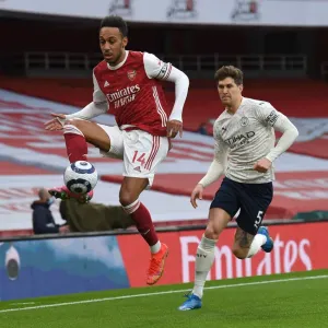 Silent Showdown: Aubameyang vs Stones - Arsenal's Battle Against Manchester City in an Empty Emirates Stadium, Premier League 2020-21 Silent Showdown: Aubameyang vs Stones - Arsenal's Battle Against Manchester City in an Empty Emirates Stadium, Premier League 2020-21