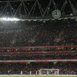 Print of a snowy football match at Emirates Stadium