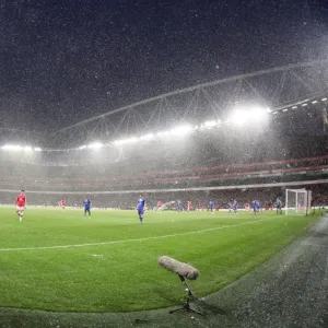 Snow falls during the match at Emirates. Arsenal 2: 2 Everton. Barclays Premier League