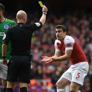 Sokratis Shown Yellow Card by Referee Taylor in Arsenal vs. Brighton Match Sokratis Shown Yellow Card by Referee Taylor in Arsenal vs. Brighton Match